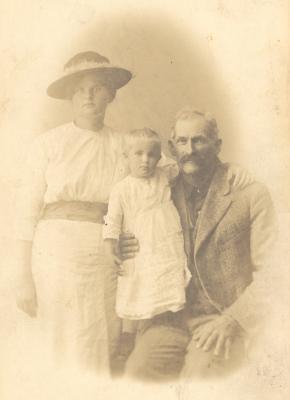 Possibly Parthine Toler Jones and husband Edward Lucas Jones with one of their children.